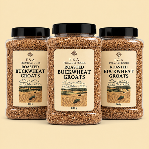 Three clear plastic jars of E&A Premium Foods Roasted Buckwheat Groats with black lids, arranged symmetrically on a light beige background.