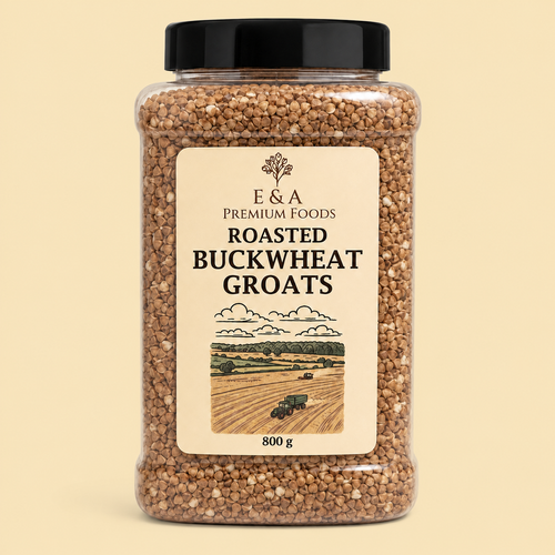 A 800g clear plastic jar of E&A Premium Foods Roasted Buckwheat Groats with a black lid and cream label, set against a solid pale beige background.